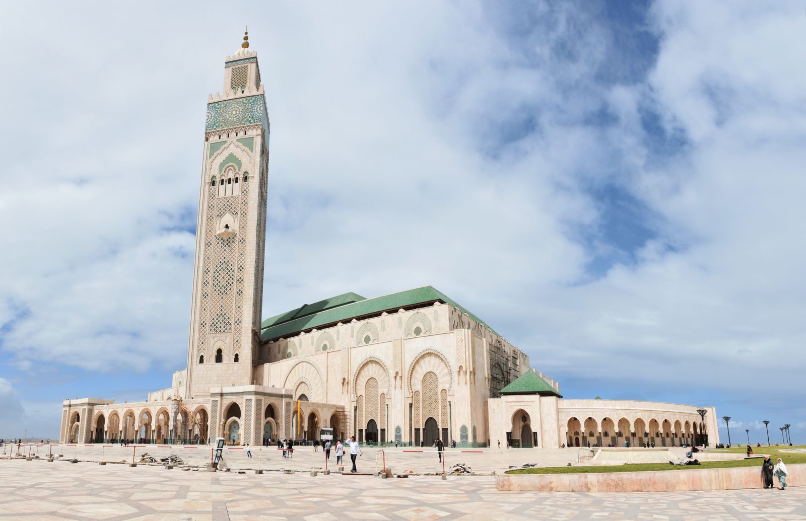 The iconic Hassan II Mosque in Casablanca under a blue sky, a key architectural work.